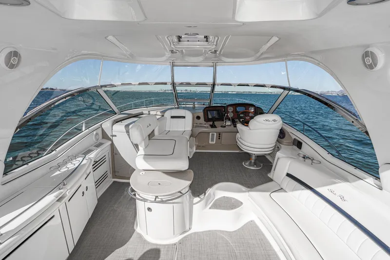 Enough 4 Now! Yacht Photos Pics Luxurious 2005 Sea Ray 500 Sundancer yacht interior with elegant seating and ocean view.
