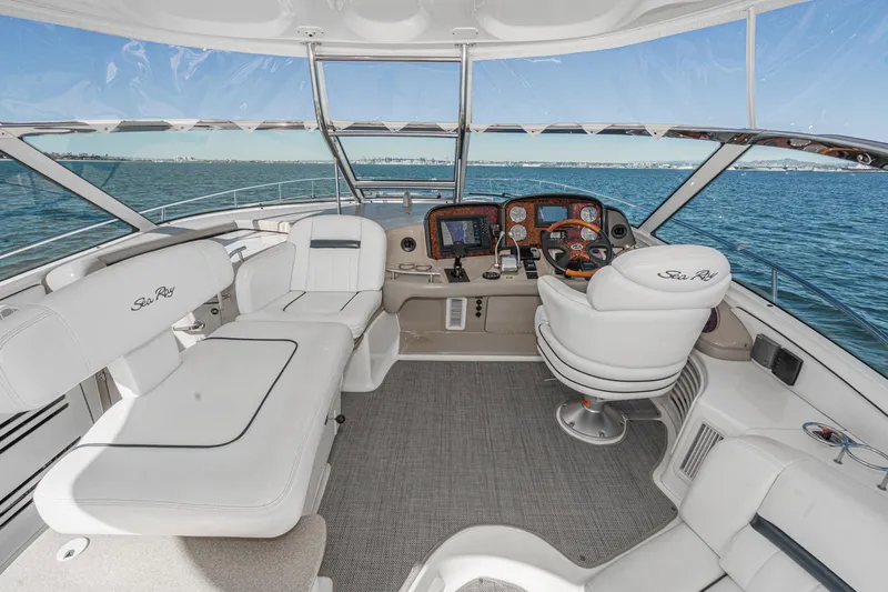 Enough 4 Now! Yacht Photos Pics 2005 Sea Ray 500 Sundancer yacht cockpit with luxurious seating and ocean view.