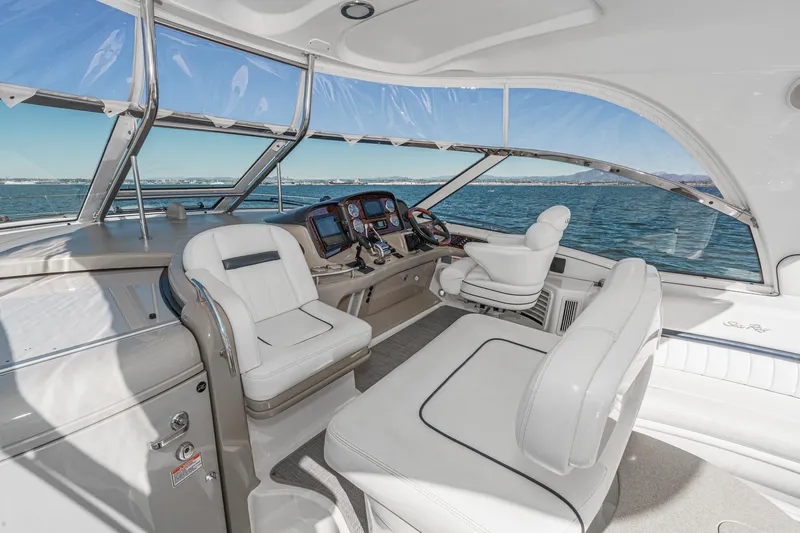 Enough 4 Now! Yacht Photos Pics Luxurious 2005 Sea Ray 500 Sundancer yacht cockpit with plush seating and ocean view.