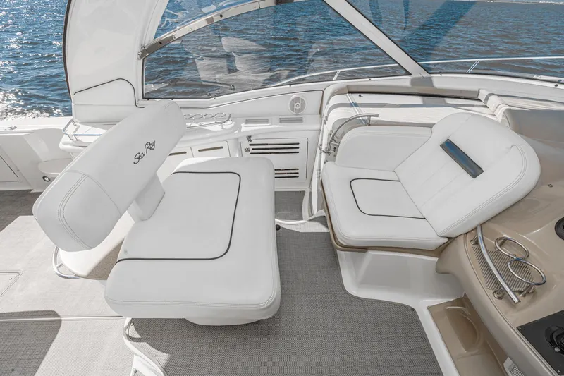 Enough 4 Now! Yacht Photos Pics Luxurious seating area on a 2005 Sea Ray 500 Sundancer yacht, overlooking the ocean.