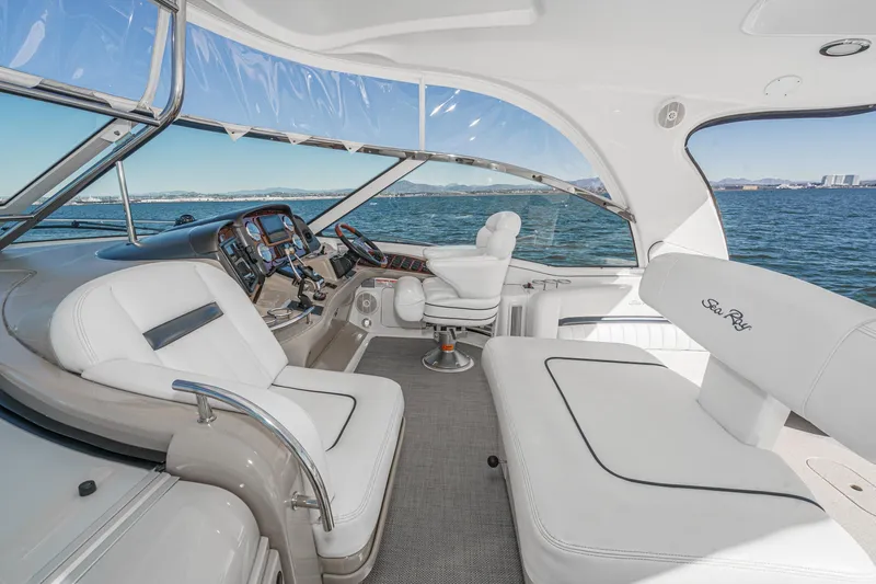 Enough 4 Now! Yacht Photos Pics Luxurious 2005 Sea Ray 500 Sundancer yacht interior with plush seating and ocean view.