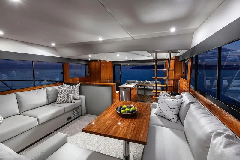 Rosewood Yacht Photos Pics Luxurious interior of 2020 Maritimo M51 yacht with elegant seating and ocean view.