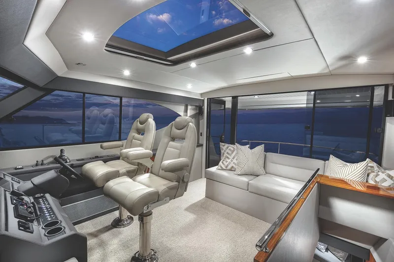 Rosewood Yacht Photos Pics Luxurious interior of 2020 Maritimo M51 yacht with plush seating and panoramic windows.
