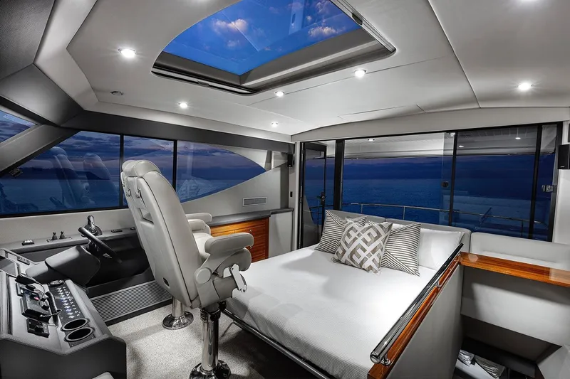Rosewood Yacht Photos Pics Luxurious interior of 2020 Maritimo M51 yacht with panoramic windows and plush seating.