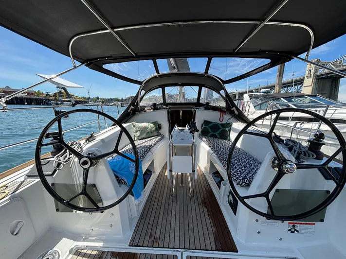  Yacht Photos Pics 2023 Jeanneau Sun Odyssey 349 cockpit with dual steering wheels and comfortable seating.