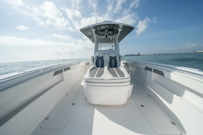 Kuhl Breeze Yacht Photos Pics 2024 Invincible 33 Catamaran on open water, showcasing sleek design and spacious deck.