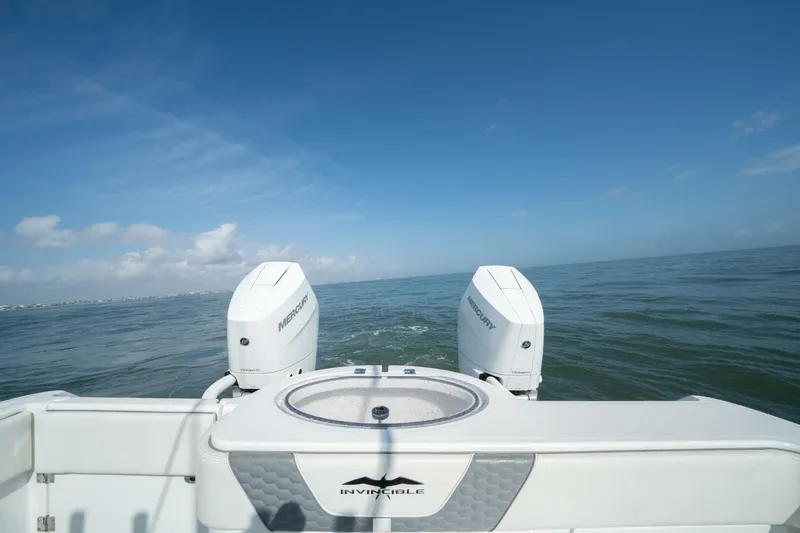 Kuhl Breeze Yacht Photos Pics 2024 Invincible 33 Catamaran with dual Mercury engines on open water.