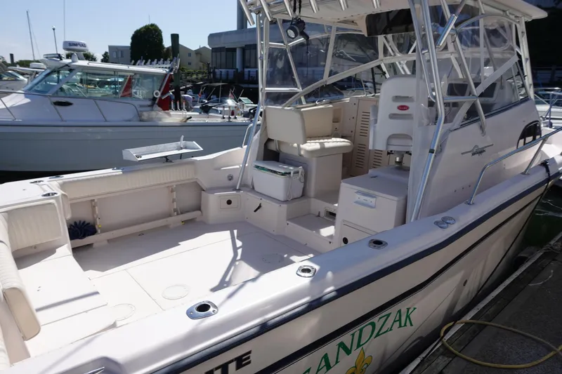  Yacht Photos Pics 2002 Grady White 300 Marlin boat docked, featuring spacious deck and seating area.