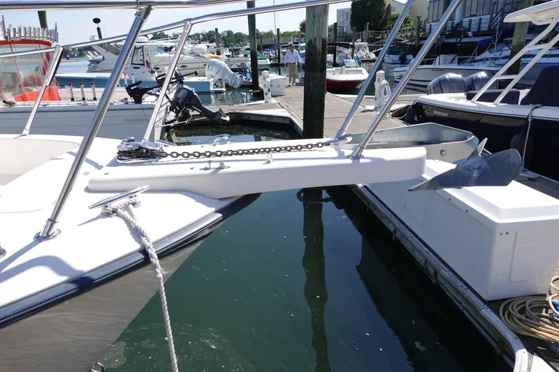  Yacht Photos Pics 2002 Grady White 300 Marlin boat docked, featuring anchor and railing.