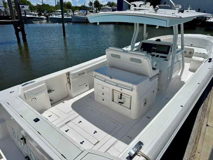  Yacht Photos Pics 2020 Intrepid 375 Nomad FE boat docked, featuring spacious deck and modern helm.