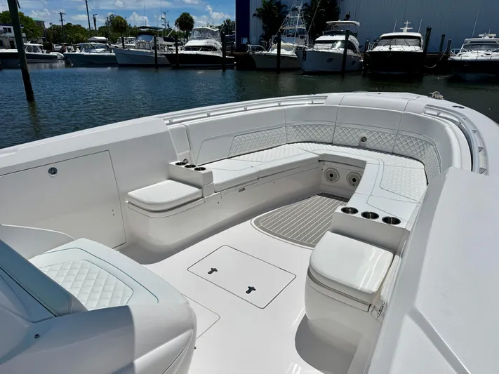  Yacht Photos Pics Luxurious seating area on a 2020 Intrepid 375 Nomad FE boat docked at a marina.