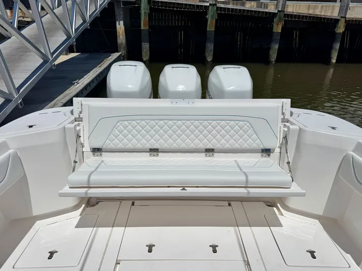  Yacht Photos Pics 2020 Intrepid 375 Nomad FE boat with triple outboard engines and foldable rear seat.