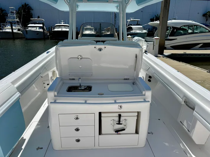  Yacht Photos Pics 2020 Intrepid 375 Nomad FE boat interior with sink and storage compartments.