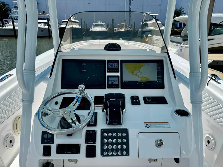  Yacht Photos Pics 2020 Intrepid 375 Nomad FE boat dashboard with navigation screens and steering wheel.