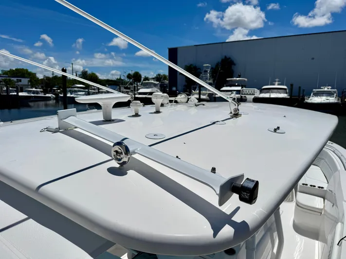  Yacht Photos Pics 2020 Intrepid 375 Nomad FE boat roof with clear sky and marina background.