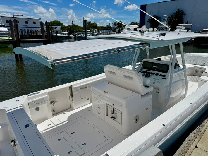  Yacht Photos Pics 2020 Intrepid 375 Nomad FE boat with spacious deck and modern helm, docked at marina.