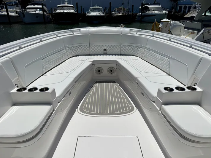  Yacht Photos Pics 2020 Intrepid 375 Nomad FE boat interior with spacious seating and cup holders.