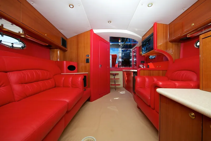  Yacht Photos Pics Luxurious red interior of a 2002 Hallett Express Cruiser yacht with leather seating.