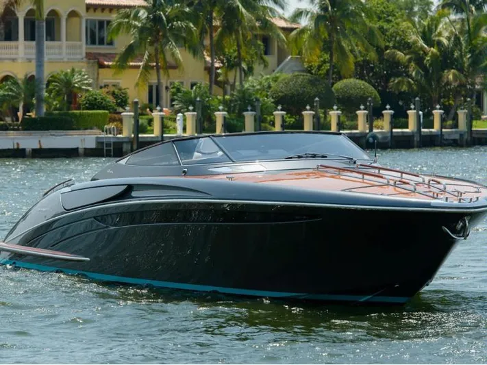  Yacht Photos Pics Luxurious 2014 Riva Rivarama Super 44 yacht cruising near waterfront homes.