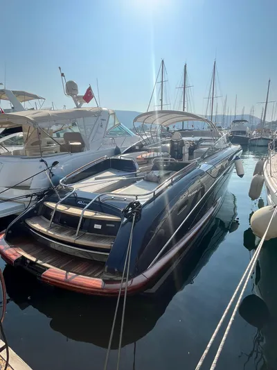  Yacht Photos Pics 2014 Riva Rivarama Super 44 yacht docked in a sunny marina.