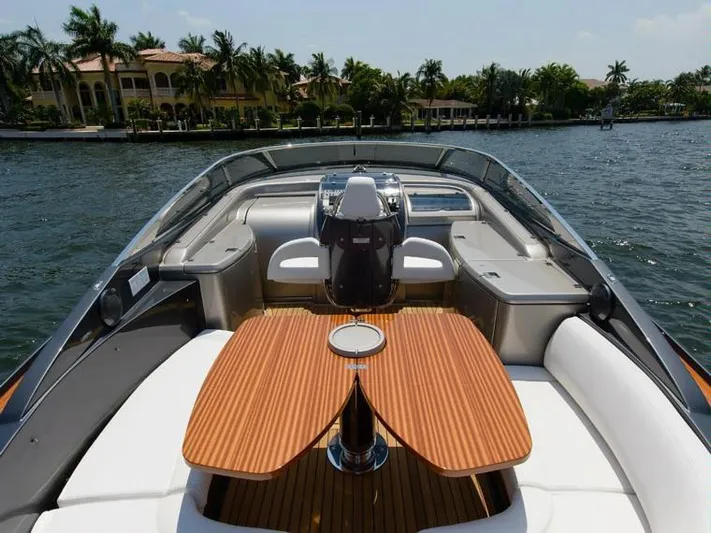  Yacht Photos Pics 2014 Riva Rivarama Super 44 luxury yacht interior with wooden table and seating.