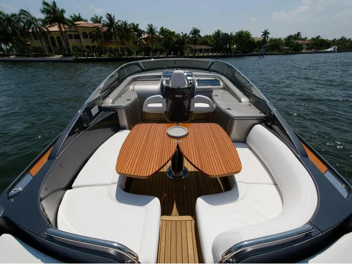  Yacht Photos Pics 2014 Riva Rivarama Super 44 luxury yacht with elegant seating and wooden table on open water.
