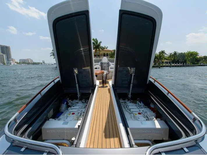  Yacht Photos Pics 2014 Riva Rivarama Super 44 yacht with open engine compartments on a sunny day.