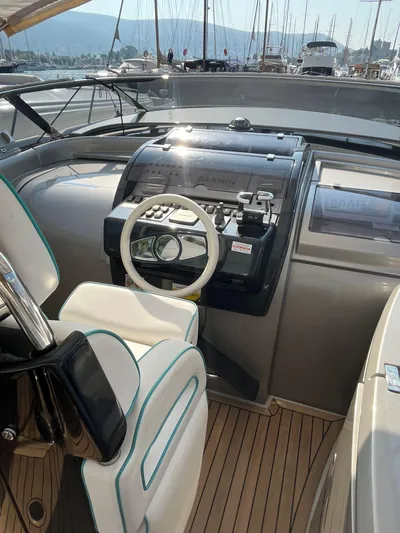  Yacht Photos Pics Cockpit of 2014 Riva Rivarama Super 44 yacht with modern controls and steering wheel.