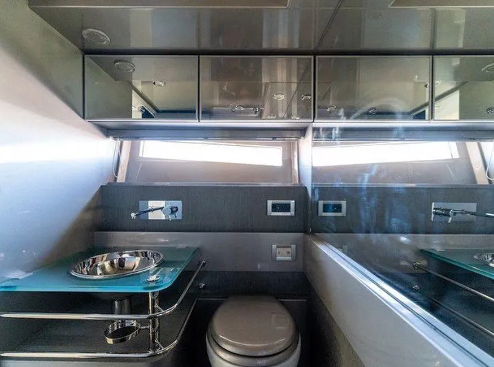  Yacht Photos Pics Luxurious bathroom interior of 2014 Riva Rivarama Super 44 yacht, featuring modern fixtures and sleek design.