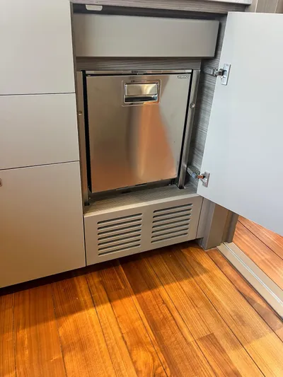  Yacht Photos Pics Stainless steel appliance in a modern kitchen cabinet on a Princess X80 yacht, 2023 model.