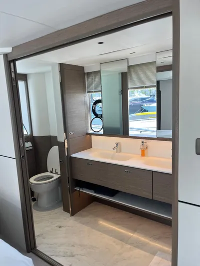  Yacht Photos Pics Luxurious bathroom interior on 2023 Princess X80 yacht, featuring dual sinks and modern design.