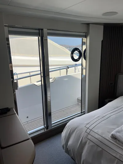  Yacht Photos Pics Luxurious cabin interior of 2023 Princess X80 yacht with balcony view.