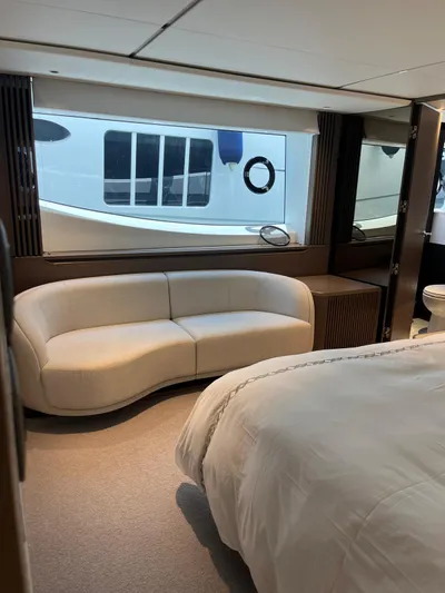  Yacht Photos Pics Luxurious interior of 2023 Princess X80 yacht with elegant seating and large window view.