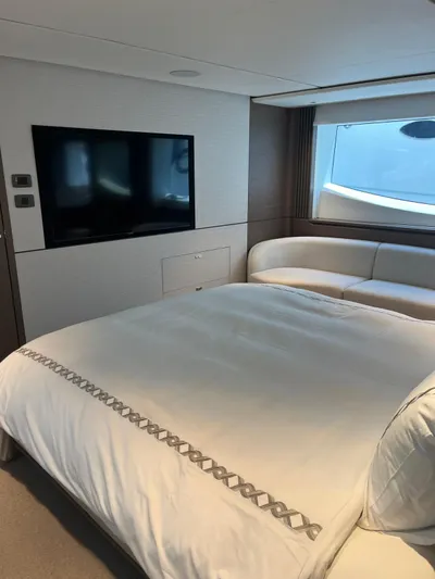  Yacht Photos Pics Luxurious bedroom interior of 2023 Princess X80 yacht with modern decor and large window.