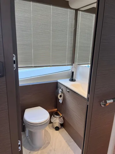  Yacht Photos Pics Modern bathroom in 2023 Princess X80 yacht with sleek design and blinds.