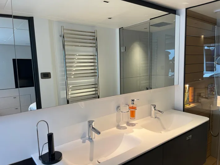  Yacht Photos Pics Luxurious bathroom interior of 2023 Princess X80 yacht with dual sinks and modern fixtures.