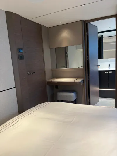  Yacht Photos Pics Luxurious interior of 2023 Princess X80 yacht cabin with modern furnishings and elegant design.