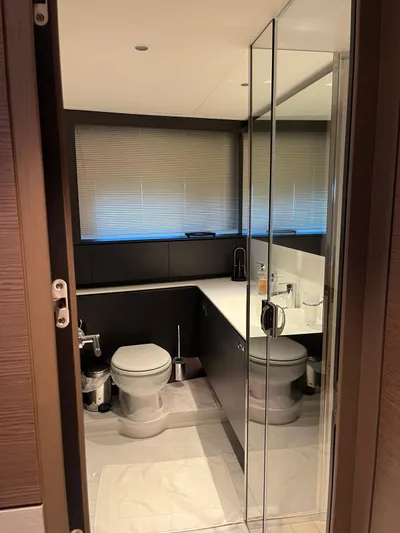  Yacht Photos Pics Luxurious bathroom in 2023 Princess X80 yacht with modern fixtures and sleek design.