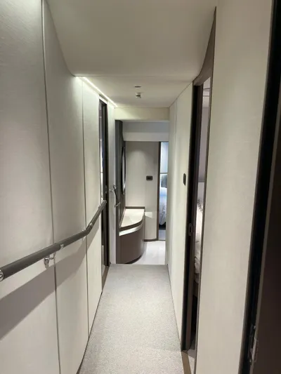 Yacht Photos Pics Luxurious interior hallway of 2023 Princess X80 yacht, featuring modern design and elegant finishes.