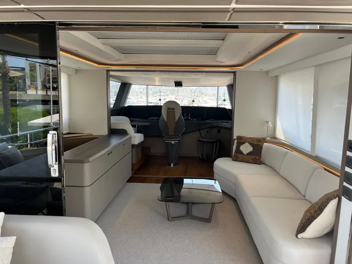  Yacht Photos Pics Luxurious interior of 2023 Princess X80 yacht with modern seating and helm station.