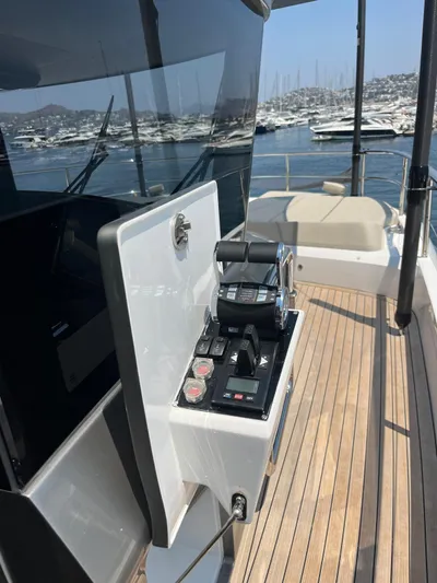  Yacht Photos Pics Control panel on 2023 Princess X80 yacht with scenic marina backdrop.