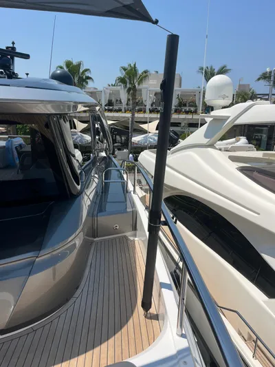  Yacht Photos Pics 2023 Princess X80 yacht docked, showcasing sleek design and luxurious deck.