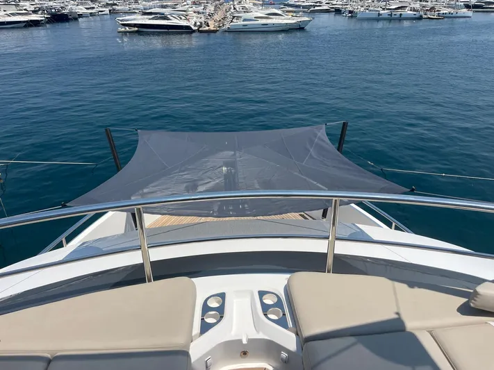  Yacht Photos Pics Luxury Princess X80 yacht deck with sunshade, overlooking marina, 2023 model.