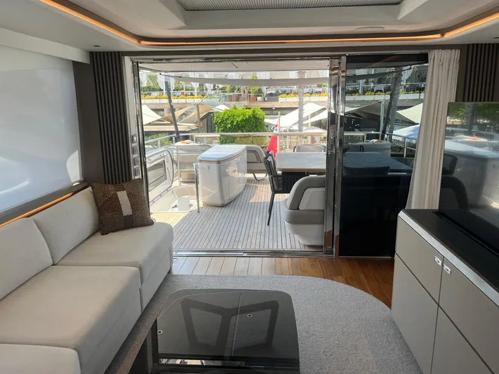  Yacht Photos Pics Luxurious interior of 2023 Princess X80 yacht with modern furnishings and outdoor deck view.