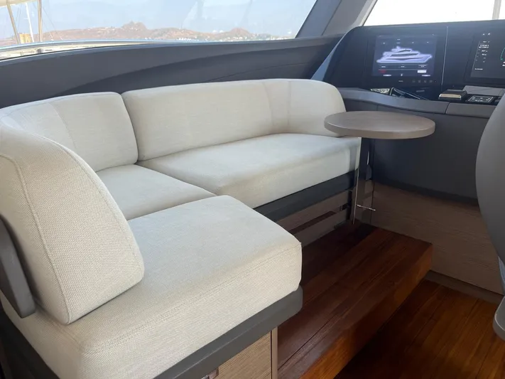  Yacht Photos Pics Luxurious interior of 2023 Princess X80 yacht with plush seating and modern controls.