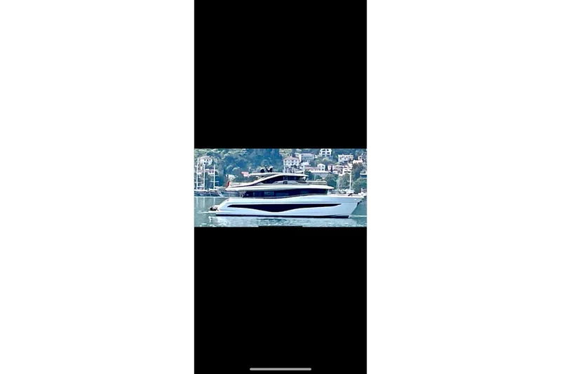  Yacht Photos Pics Luxurious 2023 Princess X80 yacht cruising on serene waters.