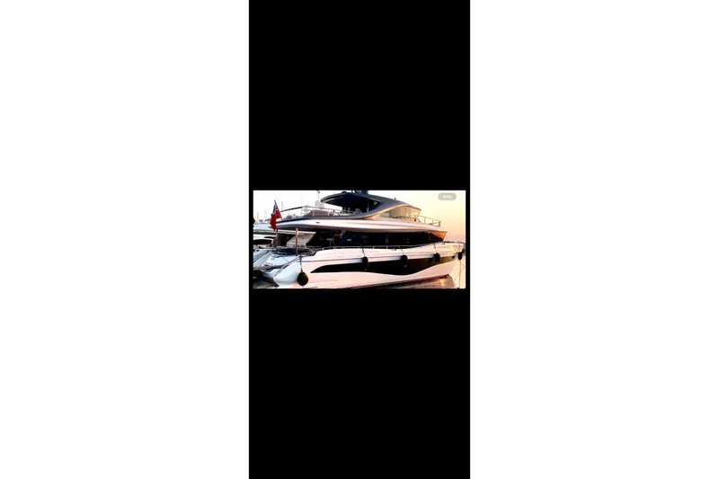  Yacht Photos Pics Luxurious 2023 Princess X80 yacht docked at sunset, showcasing sleek design and elegance.