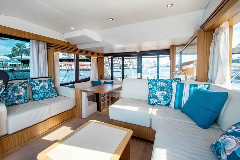  Yacht Photos Pics Luxurious interior of 2015 Absolute 56 FLY yacht with elegant seating and vibrant cushions.