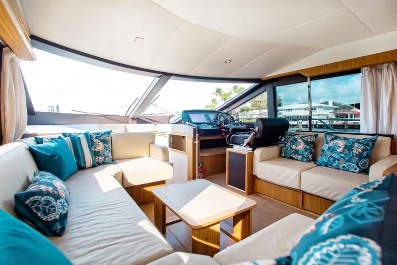  Yacht Photos Pics Luxurious interior of 2015 Absolute 56 FLY yacht with elegant seating and nautical decor.