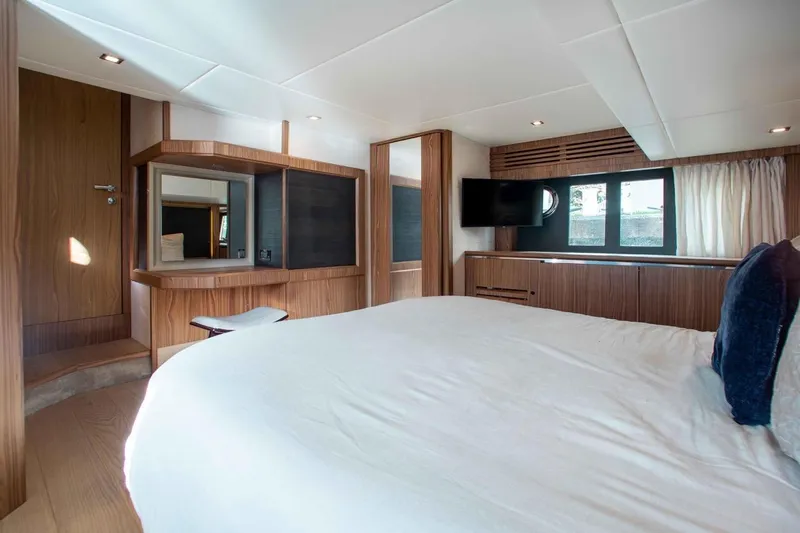  Yacht Photos Pics Luxurious cabin interior of 2015 Absolute 56 FLY yacht with modern wood finishes.